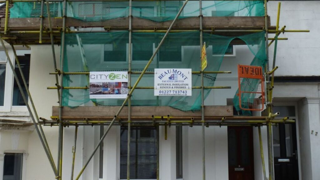 Photo shows a Cityzen sign on some scaffolding